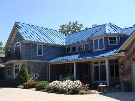 dark blue house cedar post dark metal roof|blue metal roof house exterior.